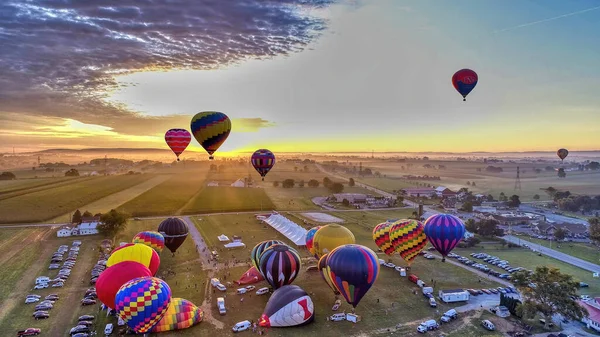 Hot Air Balloons Taking Off at Sunrise