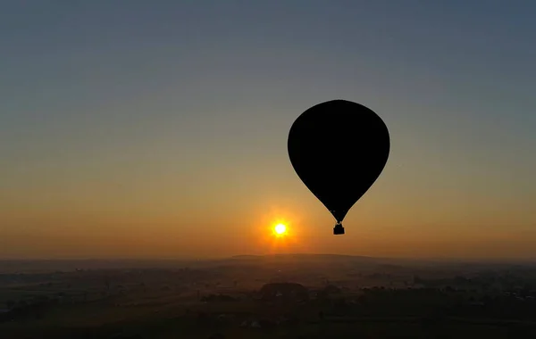 Hot Air Balloons Taking Off at Sunrise