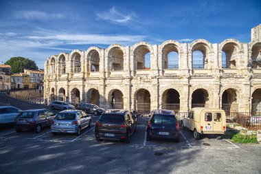 Avignon, France - October 3, 2019: The ancient Roman amphitheatre and parked cars in Avignon, France on October 3, 2019