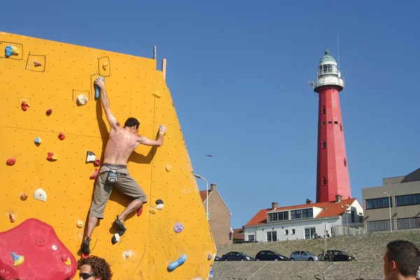 Arrampicatore e faro — Foto Stock