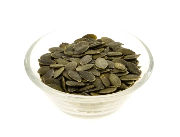 Pumpkin seeds  in a glass bowl — Stock Photo, Image