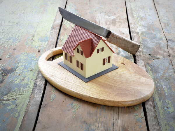 Symbol of the house is cut with a knife