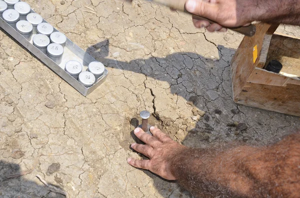 Collecting underground samples from drilled special prepared assessment point — Stock Photo, Image