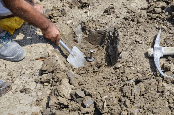 Collecting underground samples from drilled special prepared assessment point — Stock Photo, Image