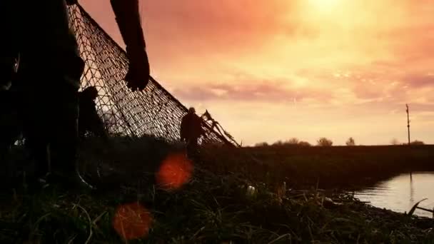 Fishing at sunset — Stock Video