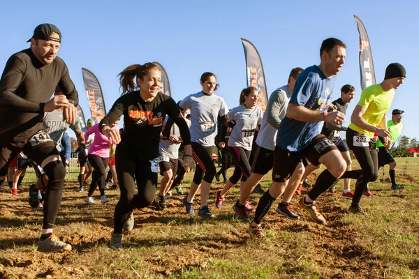 Competitors Sprint From Start Line At Obstacle Course Race — Stock Photo, Image