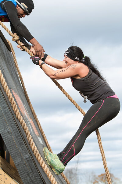 Woman Struggles Climbing Wall In Extreme Obstacle Course Race