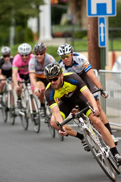 Pack Of Cyclists Lean Into Turn In Criterium Event — Stock Photo, Image