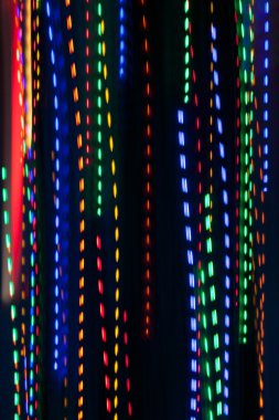 Pan renkli tatil ışıkların elektrik yağmur desen oluşturur
