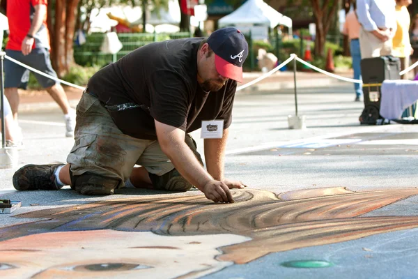 Chalk Artist Kneels And Draws Halloween Scene On Pavement — Stock Photo, Image