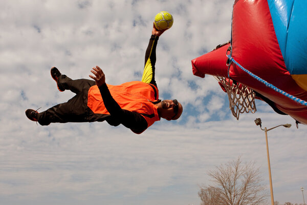 Performer Gets Sideways In Midair Attempting To Dunk Ball