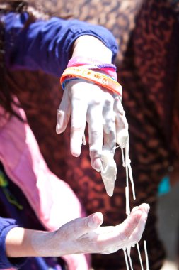 Kid Lets Goo Drip From Hand At Atlanta Science Fair clipart