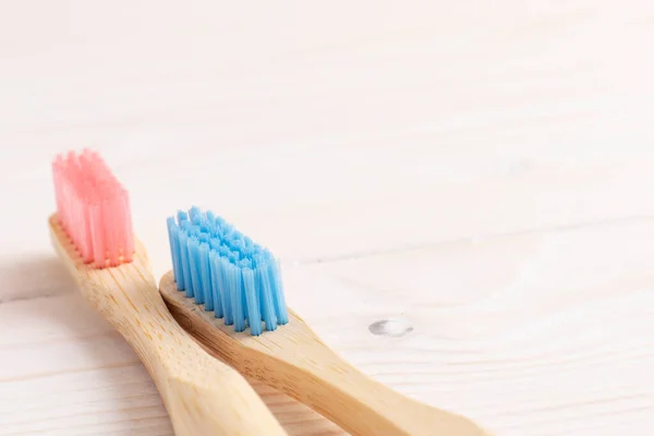 Blue Pink Bamboo Toothbrushes White Wooden Table — Stock Photo, Image