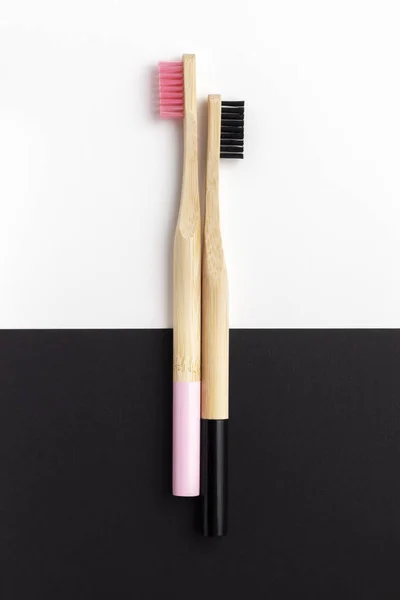 Two Wooden Toothbrushes Black Pink Bristles Black White Background Top — Stock Photo, Image