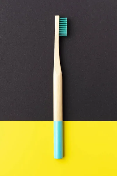 Bamboo Toothbrush Blue Bristles Black Yellow Background — Stock Photo, Image