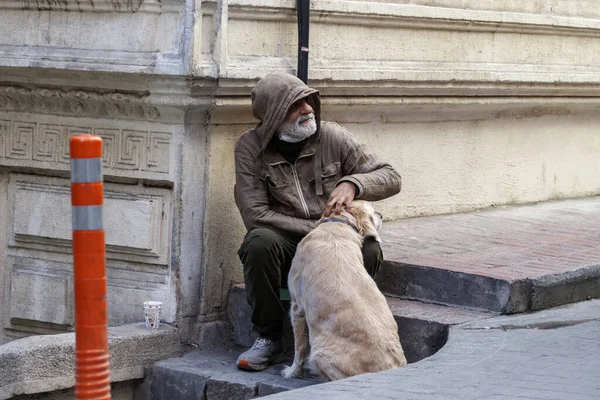 Istanbul Turkey January 2021 Beggar Sits Sidewalk Strokes Dog — Stock Photo, Image