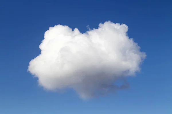 Heart shaped cloud on blue sky. Close-up. The concept of love and romance.