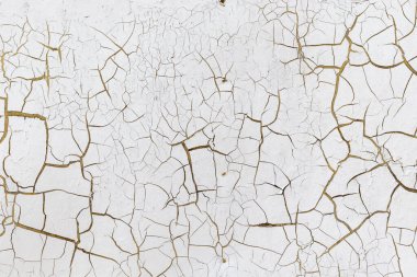 Beyaz boya, doku arkaplanı. Çatlak boyalı eski duvar.