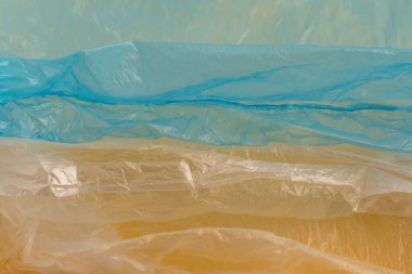 Buruşmuş plastik poşetler kullanılmış. Tam çerçeve arkaplanı.