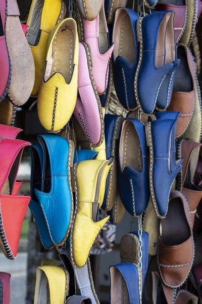 Traditional turkish handmade shoes Yemeni hanging in front of the shop. Gaziantep, Turkey.