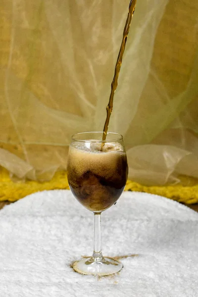 fizzy drink poured into a glass