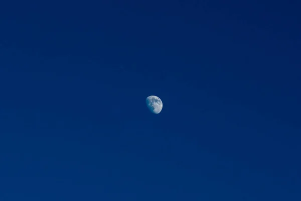 photo of the moon in the sky