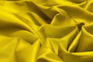 Tasarım için doğal altın kumaş kumaş dokusunun kırışıklığını kapatın. Çuval kumaş desenli. Arkaplan için Altın Tablo.