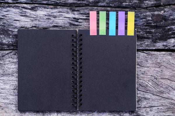 Black Diary Colored Tabs Wooden Background Five Colorful Bookmarks Notebook — Stock Photo, Image