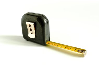 Plastic measuring tape with extended ruler on a white background close-up clipart