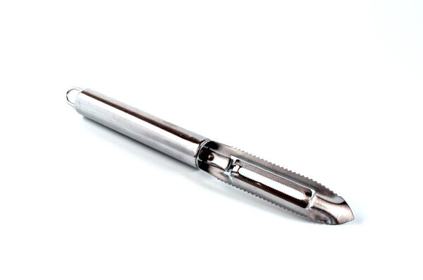 metal kitchen appliance for cleaning vegetables and fruits close-up on a white background