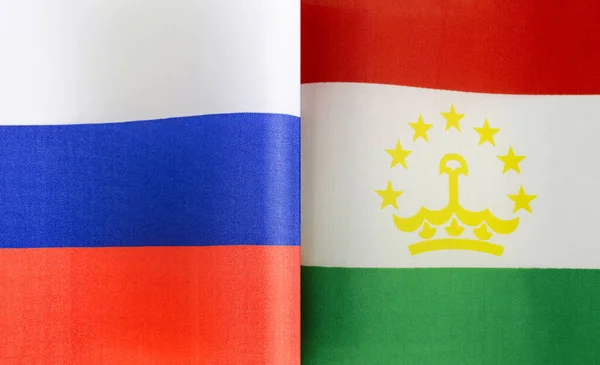 Fragmente Der Nationalflaggen Russlands Und Tadschikistans Aus Nächster Nähe — Stockfoto