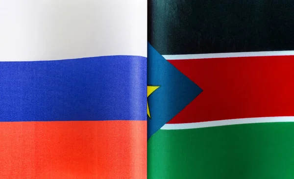 Fragmentos Las Banderas Estatales Rusia República Sudán Del Sur Cerca —  Fotos de Stock