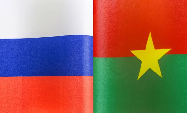 Fragmente Der Nationalflaggen Russlands Und Burkina Fasos Nahaufnahme — Stockfoto