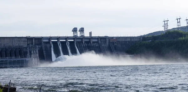 Discharge of excess water from floodgates during flooding. Discharge of excess water at hydroelectric power plants. Hydroelectric Power Station