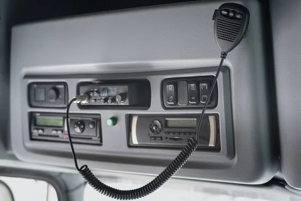 CB radio and car stereo in the truck cabin close up background.