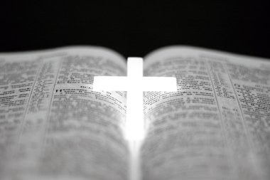 Christian cross on Bible clipart