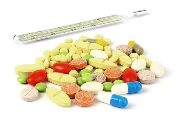 Renkli tıp hapları ve termometre