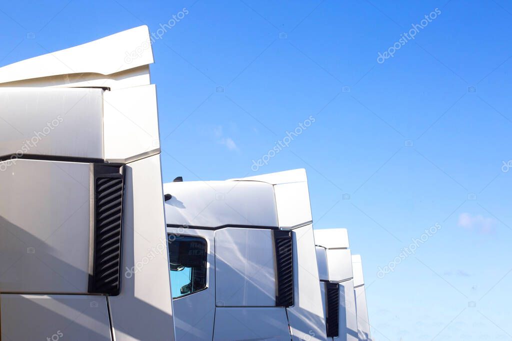 Spoilers and fairings for cabins on truck tractors against the blue sky. Aerodynamic effect concept, copy space for text, transporter
