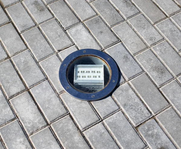 outdoor diode floodlight built into the tile, close-up
