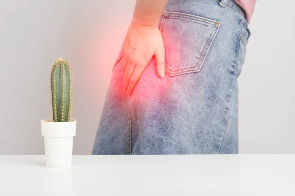 Cactus Foreground Background Girl Skirt Holding Her Anus Her Hand — Zdjęcie stockowe