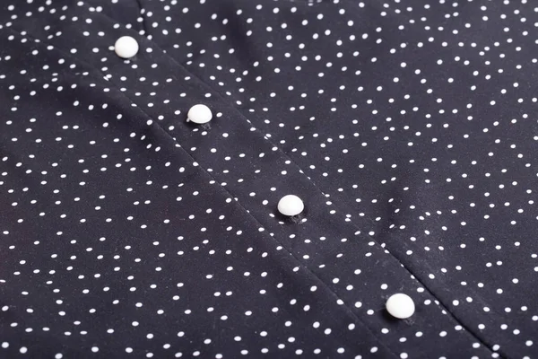 Stylish womens black blouse with buttons for business, background. Macro