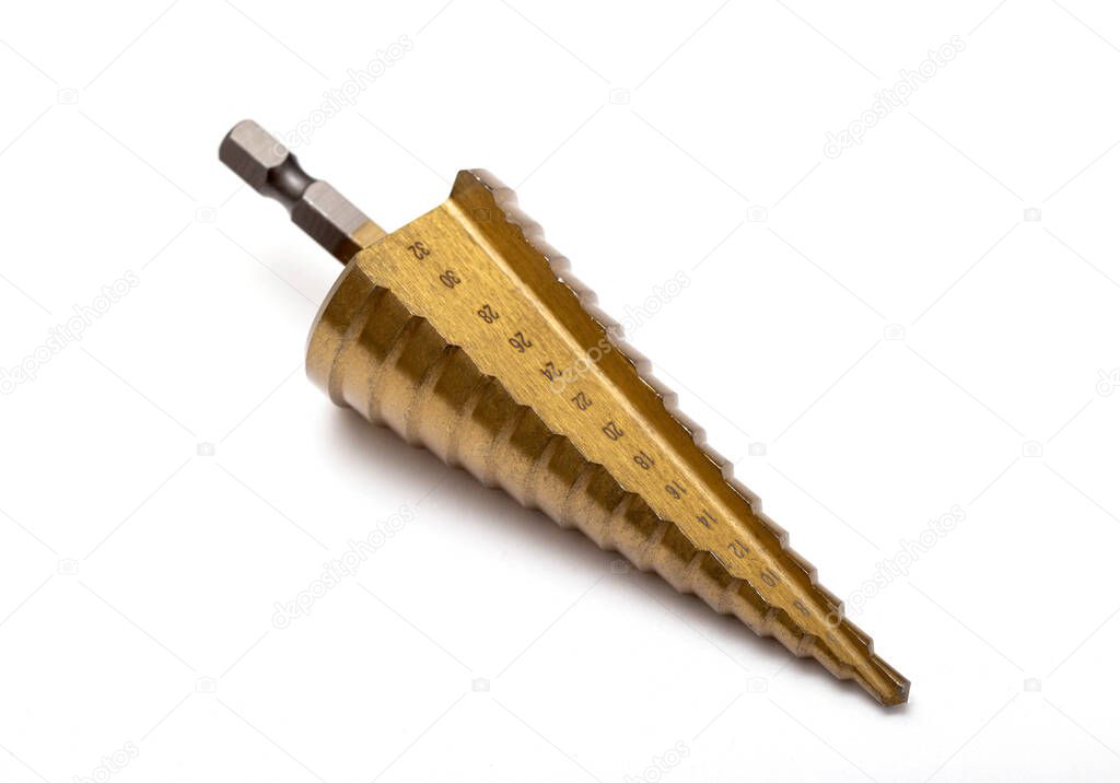 Gold step drill for drilling holes of different diameters, close-up