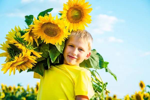 Childhood in the sunflowers — Stock Photo, Image