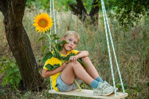 Childhood in the sunflowers — Stock Photo, Image