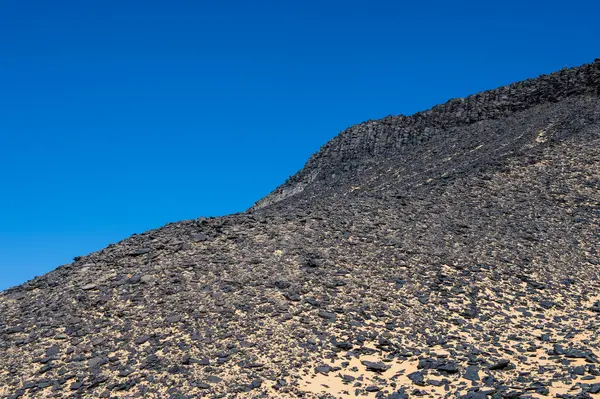 Black desert lanscape and basalt formarions — Stock Photo, Image