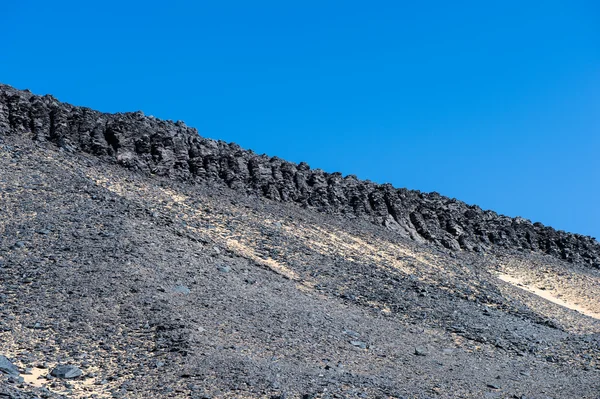 Black desert lanscape and basalt formarions — Stock Photo, Image