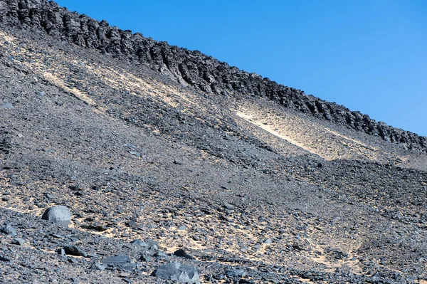 Black desert lanscape and basalt formarions — Stock Photo, Image