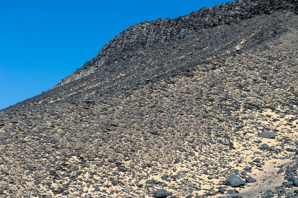 Black desert lanscape and basalt formarions — Stock Photo, Image
