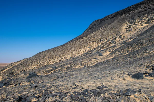 Black desert lanscape and basalt formarions — Stock Photo, Image