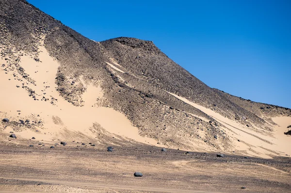 Black desert lanscape and basalt formarions — Stock Photo, Image